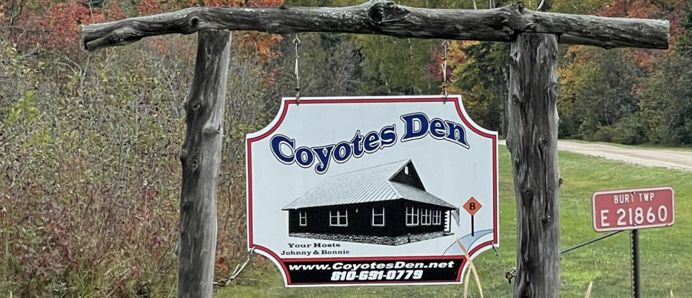 Coyotes Den sign at the entrance in Grand Marais, Michigan