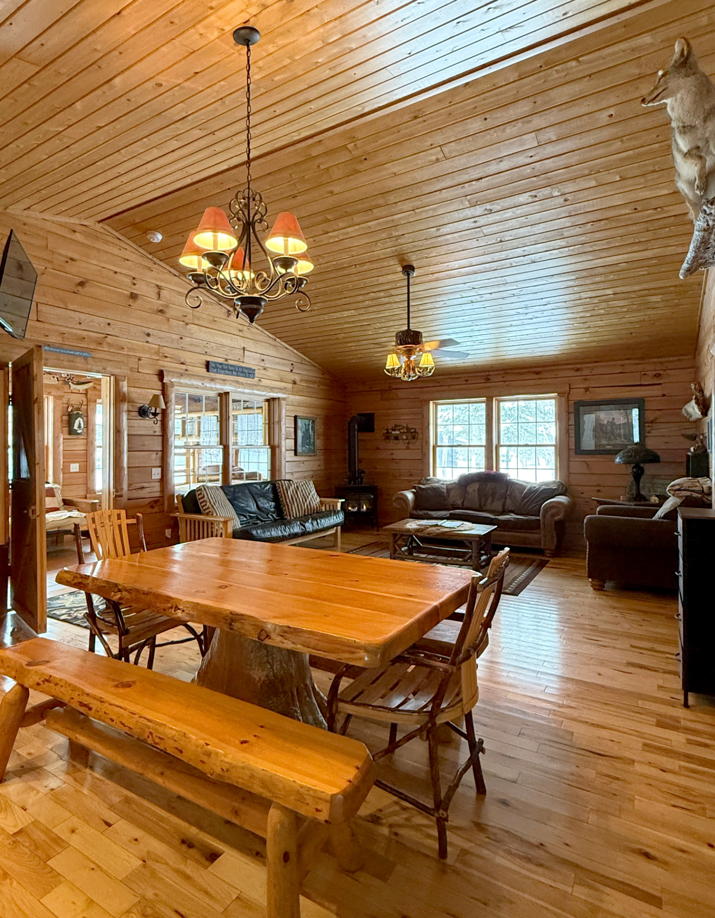 Living room with wood stove and vaulted ceilings