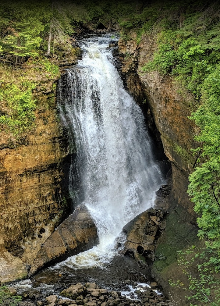 Sable Falls cascading through a sandstone canyon in summer