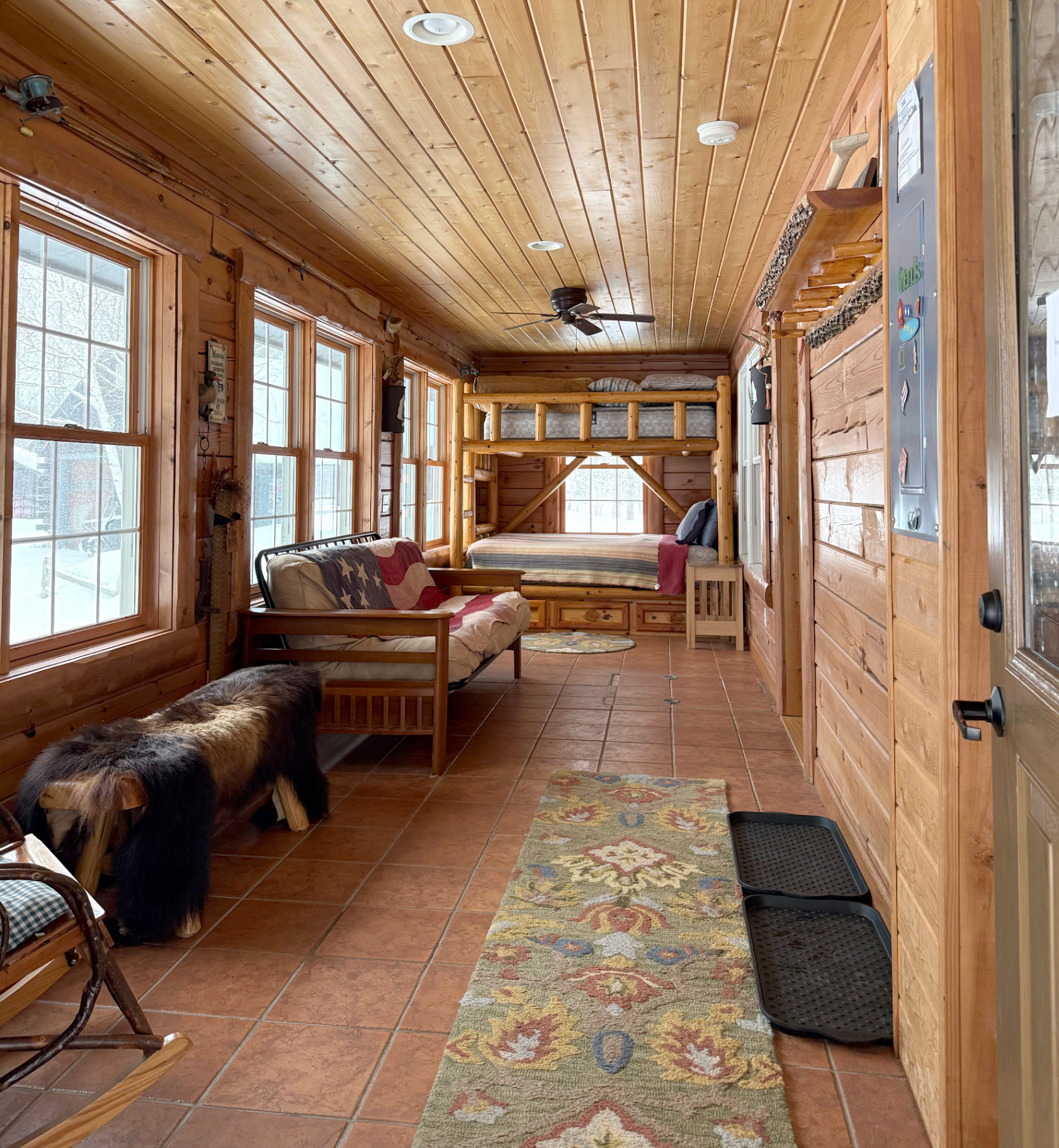 Sunroom with futon and extra bunks